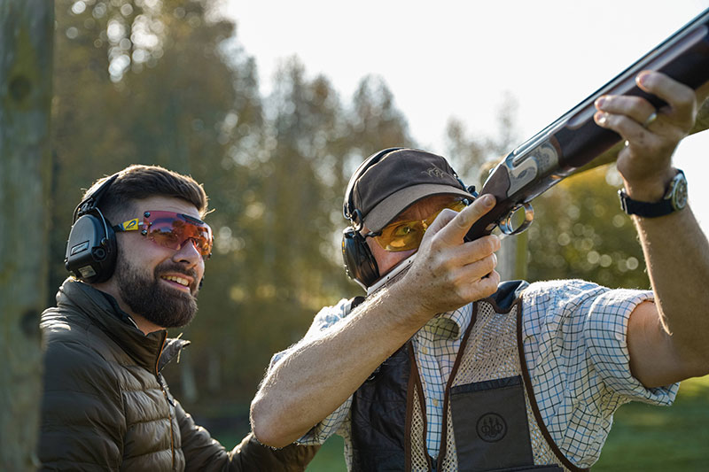 Gun Fit - A man aiming his gun